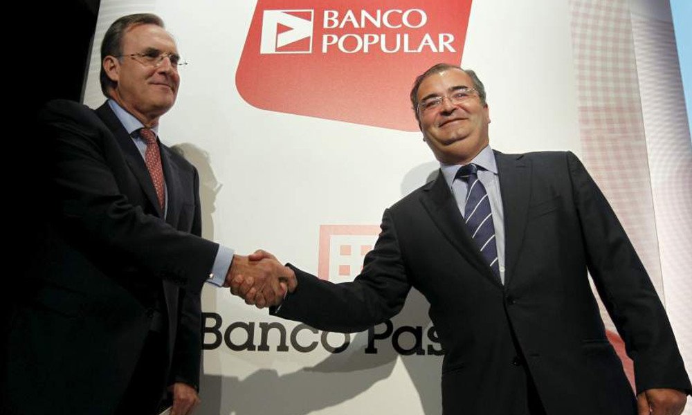 José María Arias y Ángel Ron tras el acuerdo que permitió a Banco Popular absorber a Banco Pastor