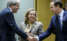 El comisario Paolo Gentiloni saluda al ministro de finanzas de Portugal, Fernando Medina, ante la mirada de Nadia Calviño