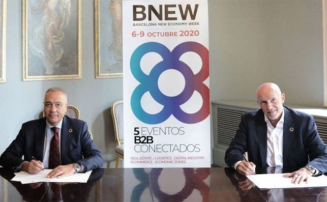 Pere Navarro y Carlos Grau en la firma del acuerdo de colaboración.